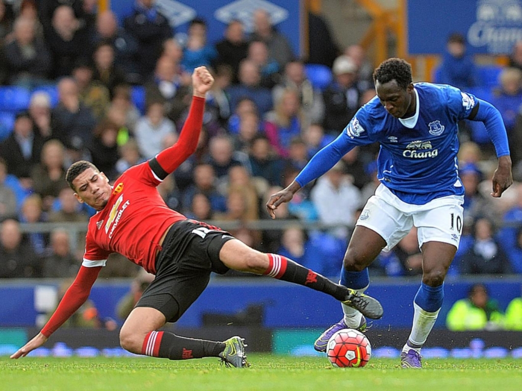 Manchester United defender Chris Smalling challenges Everton's Romelu Lukaku Getty Images