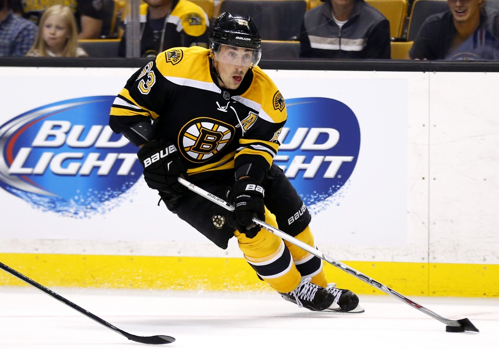 Boston Bruins&#039 Brad Marchand skates with the puck against the New York Rangers during the second period of an NHL preseason hockey game in Boston Thursday Sept. 24 2015