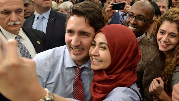 Prime minister-designate Justin Trudeau poses for a selfie with a supporter as he takes part in a welcome rally in Ottawa on Tuesday. Young voters were drawn to a post-baby boom leader