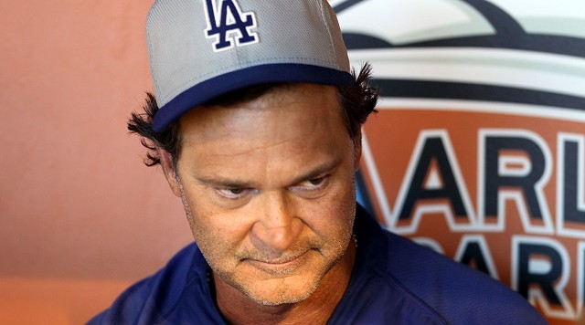 MIAMI FL- AUGUST 19 Manager Don Mattingly of the Los Angeles Dodgers sits in the duggout prior to his team playing against the Miami Marlins at Marlins Park