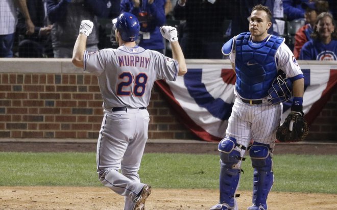 A dejected Miguel Montero watches Daniel Murphy of the Mets celebrate his two-run home run in the eighth inning. Murphy has homered in six straight playoff games