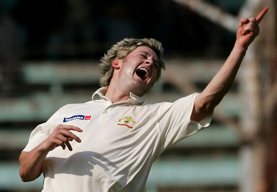 Michael Clarke exults after taking another Indian wicket in his 6 for 9 in Mumbai