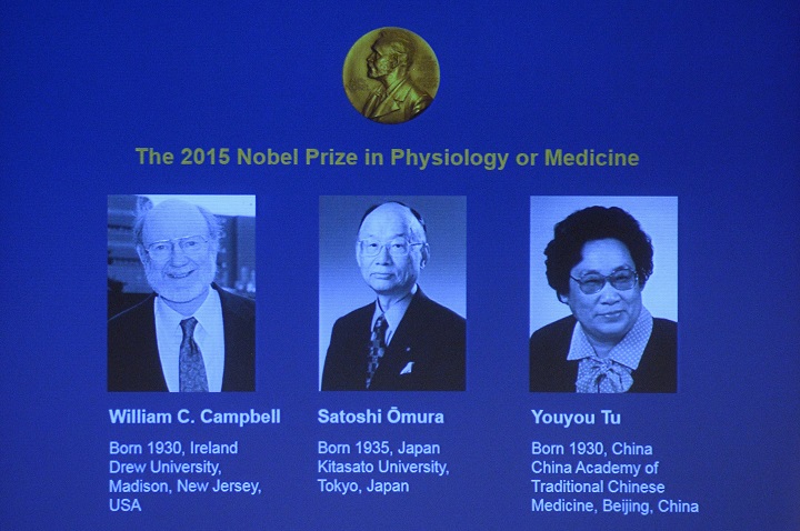 The portraits of the winners of the Nobel Medicine Prize 2015 Irish-born William Campbell Satoshi Omura of Japan and China's Youyou Tu are displayed on a screen during a press conference of the Nobel Committee to announce the winners of the 20