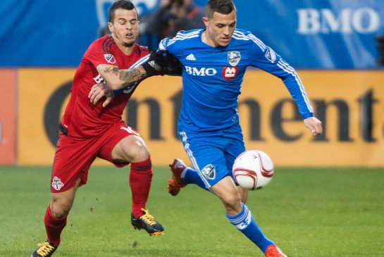 Montreal Impact's Donny Toia right breaks away from Toronto FC's Sebastian Giovinco during first half MLS soccer action in Montreal Sunday