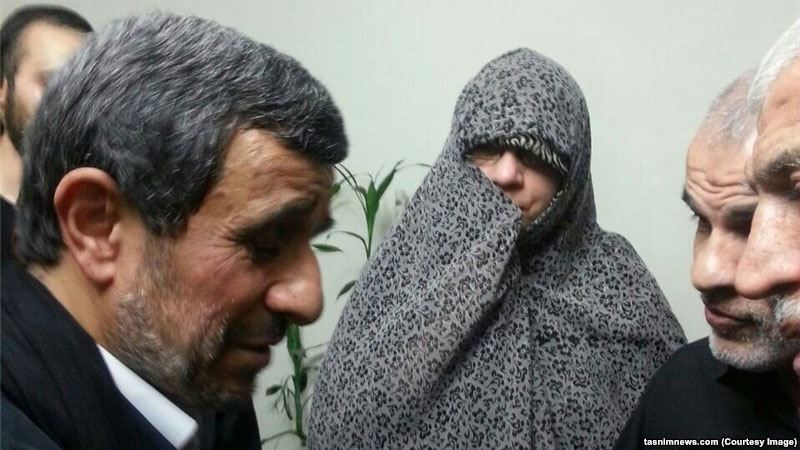 Former Iranian President Mahmud Ahmadinejad visits the family of one of his ex-bodyguards who was killed in Syria