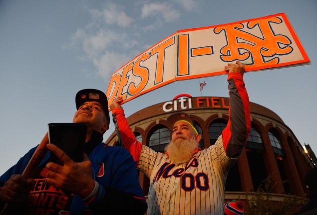 Edwin'Cowbell Man Boison and Sal Candiano stand outside Citi Field prior to Game 1 of the 2015 MLB National League Championship Series between Chicago Cubs and the New York Mets