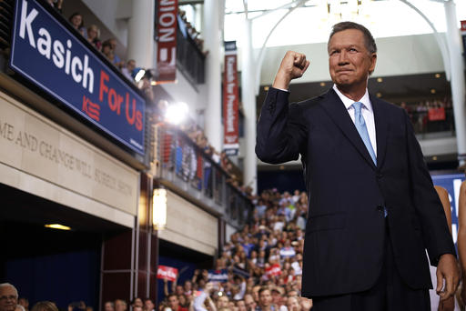 John Kasich governor of Ohio gestures while arriving to announce he will seek the 2016 Republican presidential nomination in Columbus Ohio