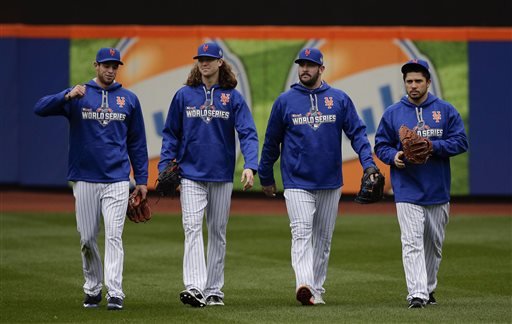 From left New York Mets pitchers Steven Matz Jacob de Grom and Matt Harvey and catcher Travis d'Arnaud walk off the field at the end of batting practice Saturday Oct. 24 2015 in New York. The Mets will face the Kansas City Royals in Game 1 of the Wo