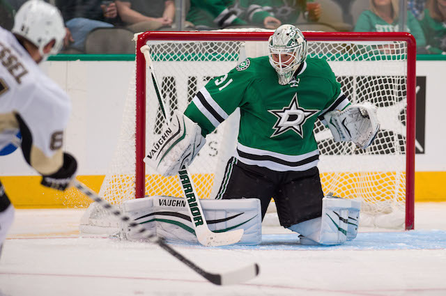 Penguins Stars Hockey Penguins&#39 Evgeni Malkin attempts to gain control of the puck against Dallas Stars&#39 Jason Demers as Penguins&#39 Sergei Plotnikov watches in the second period