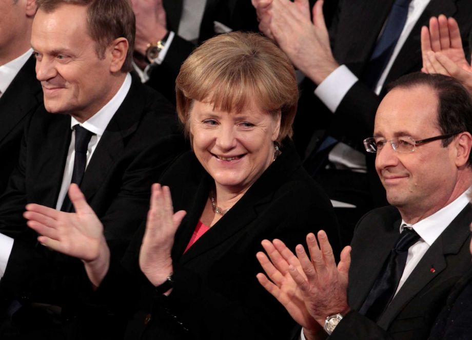 Poland's Prime Minister Donald Tusk left German Chancellor Angela Merkel center and French President Francois Hollande applaud during the Nobel Peace Prize ceremony at the City Hall in Oslo. The Europe