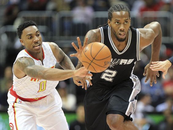 Kawhi Leonard steals from the ball from Atlanta Hawks Jeff Teague during the first first half of an NBA preseason basketball game Wednesday Oct. 14 2015 in Atlanta. MARIETTA