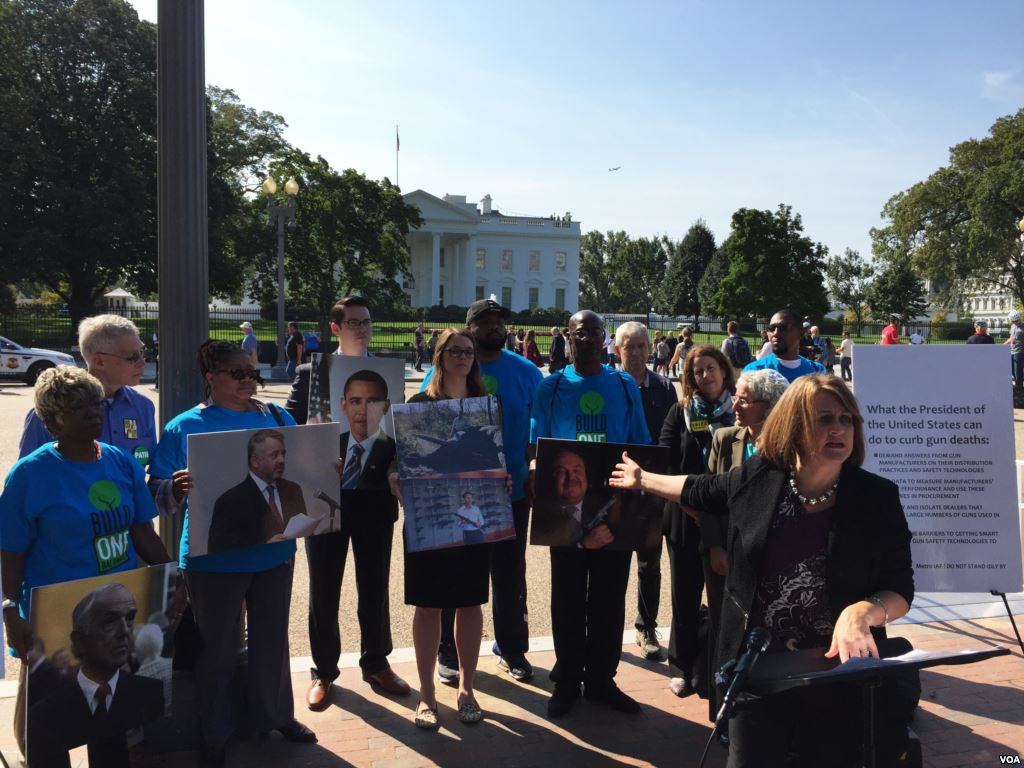 DiAne Boese was accidentally shot in the face by another child when she was three-years-old. She joined a group across the street from the White House Thursday calling on the president to pressure gun manufacturers for more smart gun technology. (VOA pho