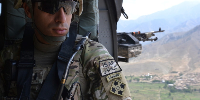 U.S. Army 1st. Lt. Florent A. Groberg officer in charge for personal security detail 4th Brigade Combat Team 4th Infantry Division enjoys the view from a UH-60 Black Hawk helicopter traveling over the Kunar province