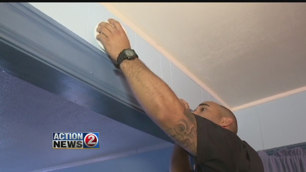 Man installing smoke detector