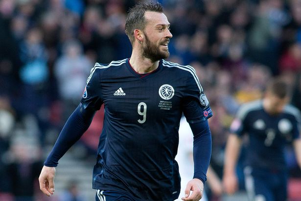 Scotland's Steven Fletcher celebrates his goal to complete his hat-trick