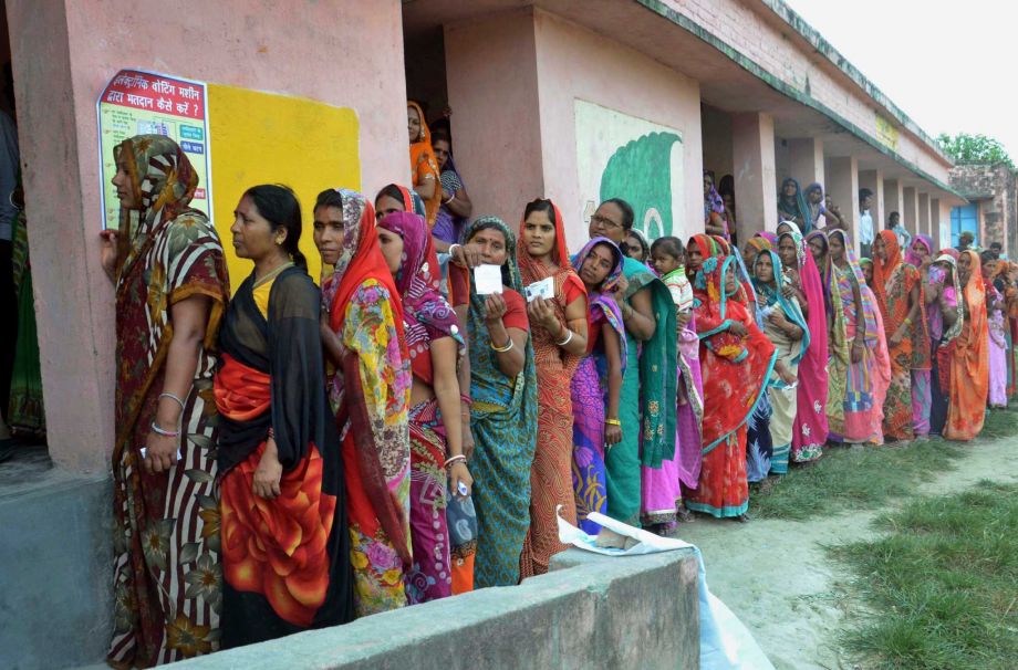 Indian women voters stand in a queue to cast their votes at a polling station during the first of the five phase voting for state legislative assembly at Samastipur district in India’s eastern state Bihar Monday Oct. 12 2015. Hundreds of thousands