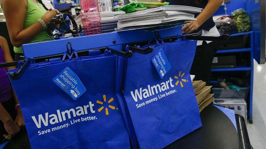 A cashier scans school supplies for a customer at a Wal Mart Stores Inc. location in the Porter Ranch neighborhood of Los Angeles California