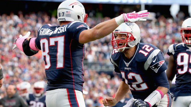 FOXBORO MA- OCTOBER 25 Tom Brady #12 and Rob Gronkowski #87 of the New England Patriots react after Gronkowski scored a touchdown during the fourth quarter against the New York Jets at Gillette Stadium