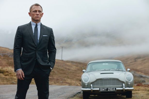 James Bond actor Daniel Craig and an Aston Martin DB5