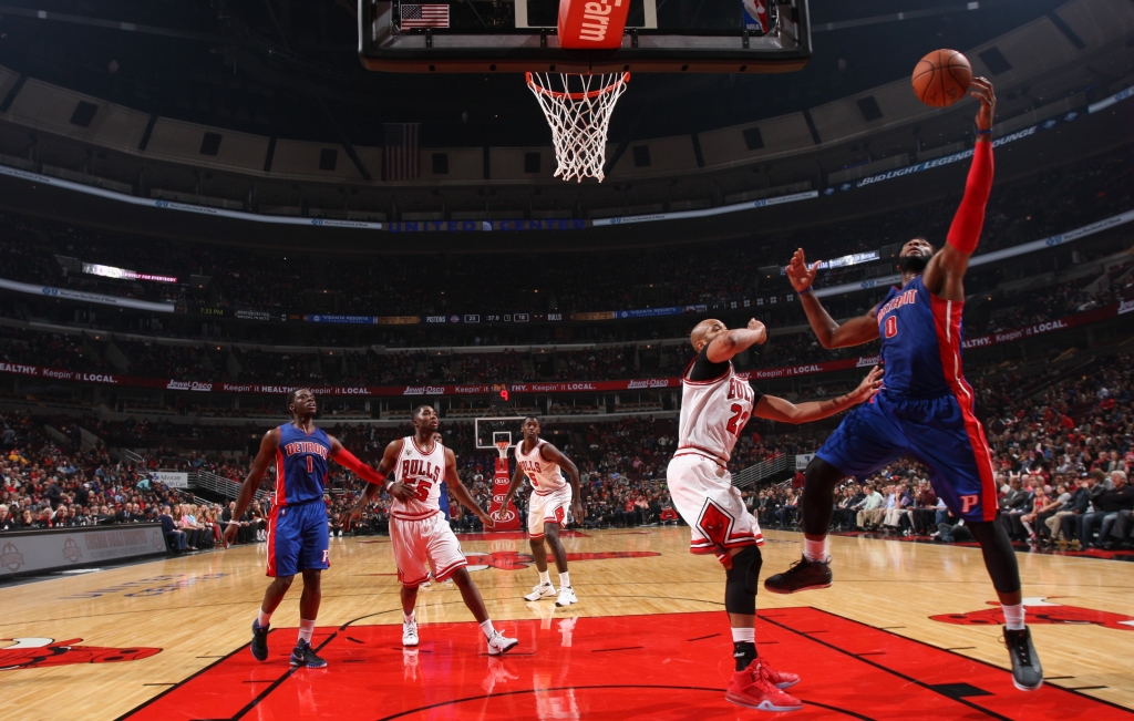 Pistons center Andre Drummond goes up for a layup while being defended by Bulls forward Taj Gibson