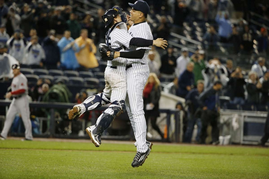 New York Yankees catcher John Ryan Murphy left and New York Yankees relief pitcher Dellin Betances celebrate after the Yankees clinched a wild-car berth in the playoffs by defeating the Boston Red Sox 4-1 in a baseball game in New York Thursday Oct. 1