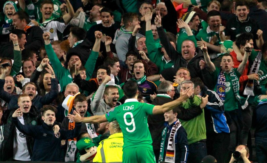 Ireland's Shane Long celebrates with fans after scoring the opening goal during the Euro 2016 group D qualifying soccer match between Ireland and Germany in Dublin Ireland Thursday Oct. 8 2015