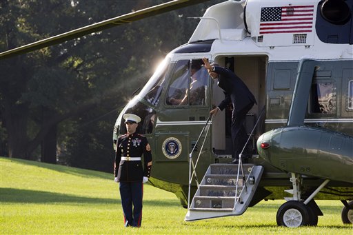 President Barack Obama waves as he boards Marine One on the South Lawn of the White House in Washington Friday Oct. 9 2015 for a short trip to Andrews Air Force Base Md. before leaving for Roseburg Oregon to meet with families of victims of the sho