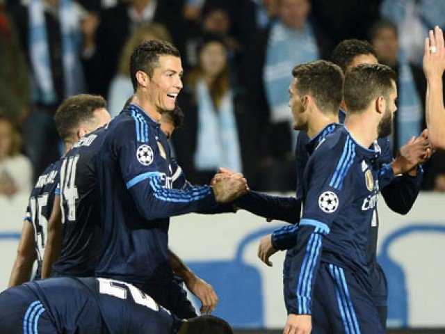 Real Madrid's Cristiano Ronaldo celebrates with teammates after scoring the opening goal against Malmo FF during their Champions League group A soccer match at Malmo New Stadium in Malmo Sweden