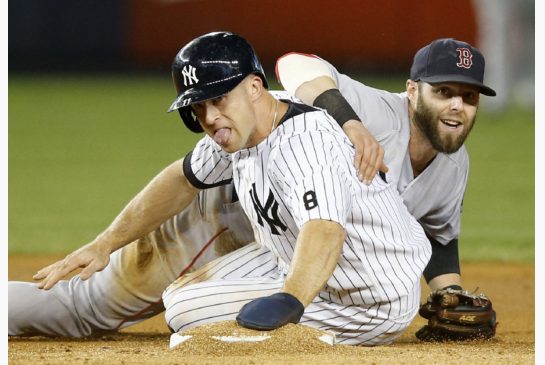 The Yankees Brett Gardner is put out at second by Boston's Dustin Pedroia during fifth-inning action Tuesday night in New York