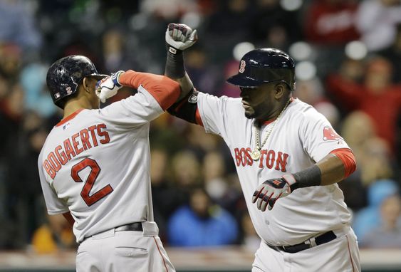 David Ortiz right is congratulated by Xander Bogaerts after Ortiz hit a two-run home run off Cleveland Indians starting pitcher Josh Tomlin in the fourth inning of a baseball game Friday Oct. 2 2015 in Cleveland. Bogaerts scor