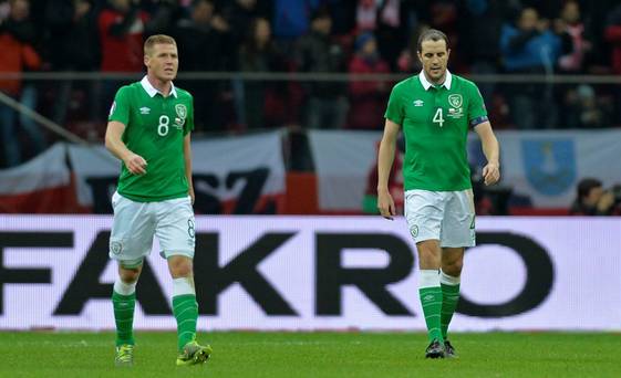 Football- Poland v Republic of Ireland- UEFA Euro 2016 Qualifying Group D- Stadion Narodowy Warsaw Poland- 11/10/15
Ireland's John O'Shea and James Mc Carthy look dejected after Poland's Robert Lewandowski scores their