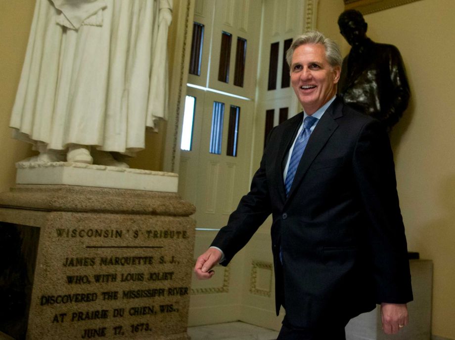 House Majority Leader Kevin Mc Carthy of Calif. walks toward the House Chamber on Capitol Hill in Washington Friday Oct. 9 2015. In the unruly House Republicans enjoy a near-historic majority yet deep divisions between ultra-conservatives and more tra