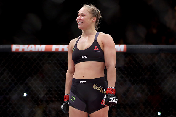 Ronda Rousey of the United States defeats Bethe Correia of Brazil in their bantamweight title fight during the UFC 190