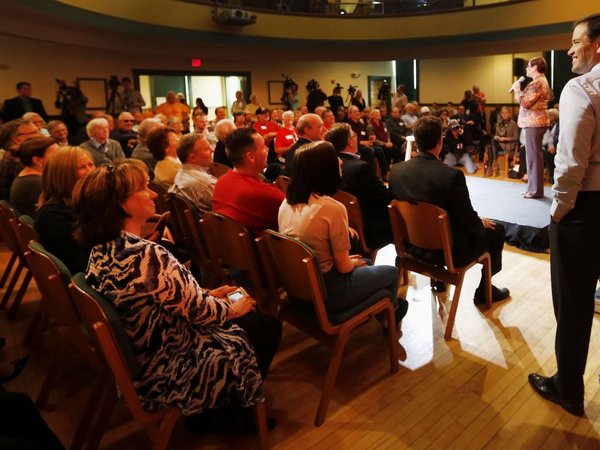 Republican presidential candidate Sen. Marco Rubio R-Fla. listens as he is introduced during a town hall campaign stop Wednesday Oct. 14 2015 in Derry N.H