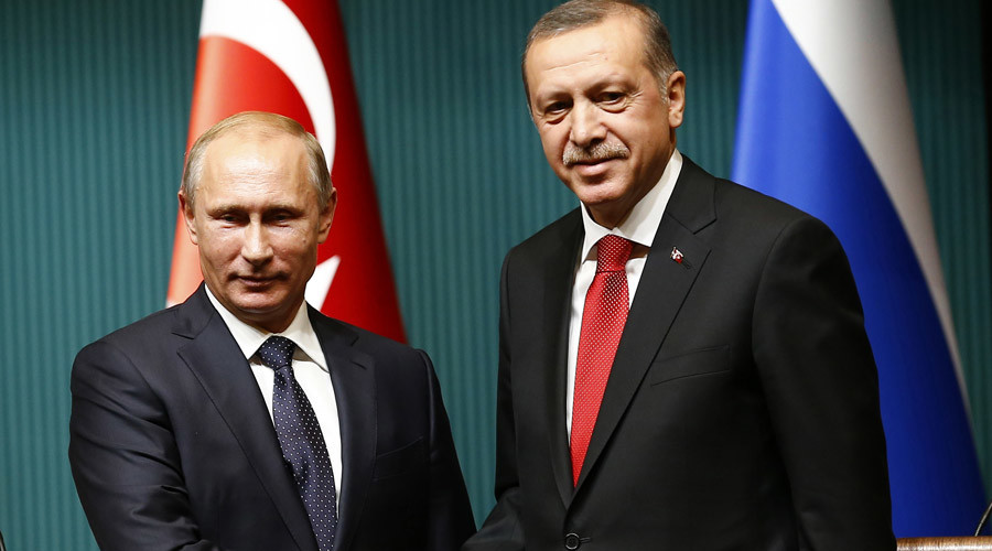 Russia's President Vladimir Putin shakes hands with Turkey's President Tayyip Erdogan