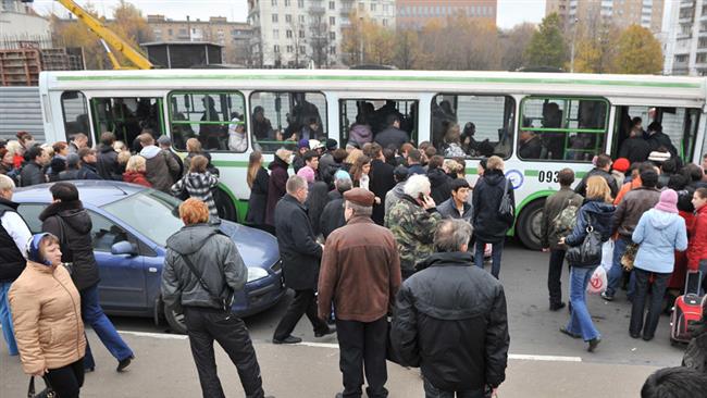 An image released by Russia Today shows people gathered in an area in the capital Moscow where security forces launched a raid to arrest suspected militants