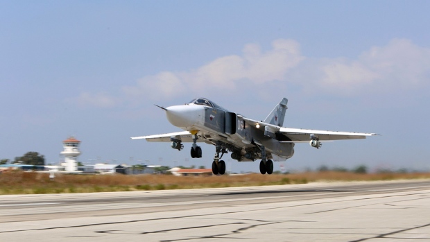 A Russian SU-24M jet fighter armed with laser guided bombs takes off from a runaway at Hmeimim airbase in Syria. Russians have been carrying out airstrikes in Syria since last Wednesday