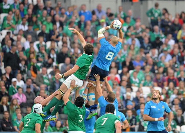 Italy's captain Sergio Parisse wins the ball in a line out against Ireland's Iain Henderson during their Rugby World Cup Pool D match between Ireland and Italy at the Olympic Stadium London Sunday Oct. 4 2015