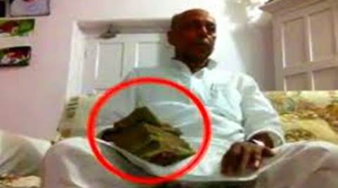 Screenshot of a video shows Awadhesh Prasad Kushwaha receiving money