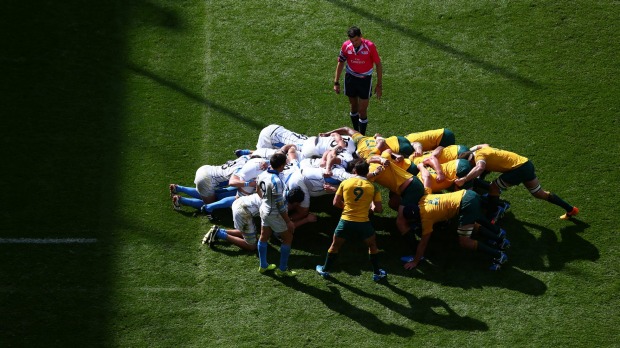 Scrummaging Halfback Nick Phipps prepares to put the ball into the scrum against Uruguay