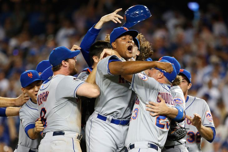 Ruben Tejada of the NY Mets is hit by a slide by Chase Utley of the LA Dodgers