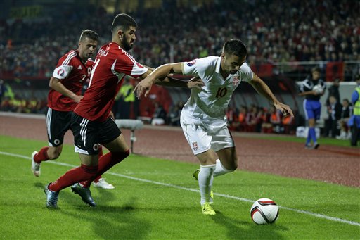 Albania's Elseid Hysaj left tries to stop Serbia's Dusan Tadic during the group I Euro 2016 qualifying match between Albania and Serbia at the Elbasan Arena in Elbasan central Albania Thursday Oct. 8 2015