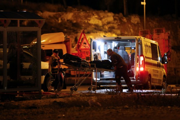 AFP  Ahmad Gharabli Israeli medics carry away the body of one of two Palestinian men who attacked an Israeli soldier in a stabbing attack before being shot at a junction near the Jewish settlement of Gush Etzion in Israeli occupied West Bank on October