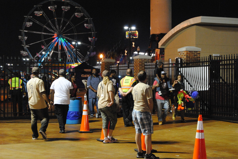 State Fair employees and law enforcement officers directed traffic at the exit gates after Saturday night's shooting