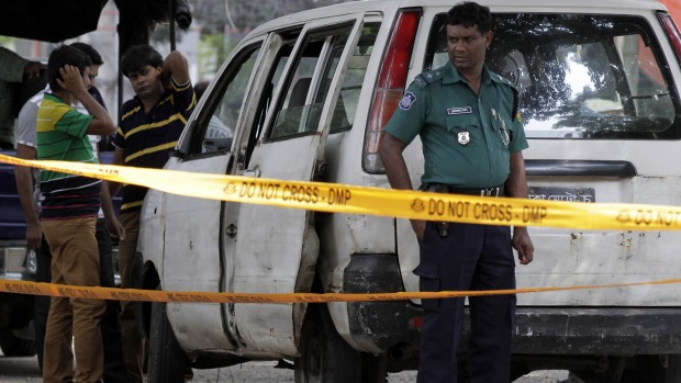 Strife torn Bangladeshi police set up a crime scene at the spot where Italian citizen Cesare Tavella was gunned down