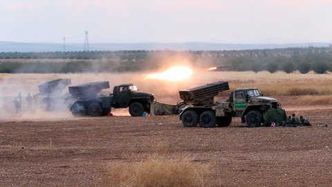 Syrian army rocket launchers fire near the village of Morek in Syria