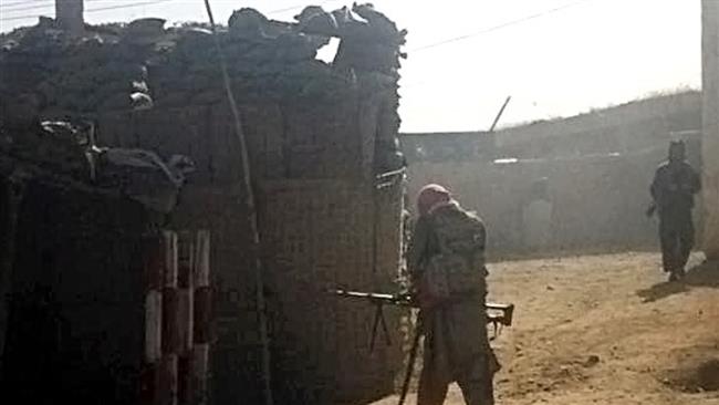 Taliban fighters take their positions after occupying a police station for several hours in Kunduz city north of Kabul Afghanistan Monday Sept. 28 2015