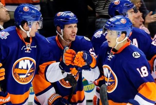 New York Islanders celebrate on the ice after defeating the Winnipeg Jets 4-2 in an NHL hockey game Monday Oct. 12 2015 in New York