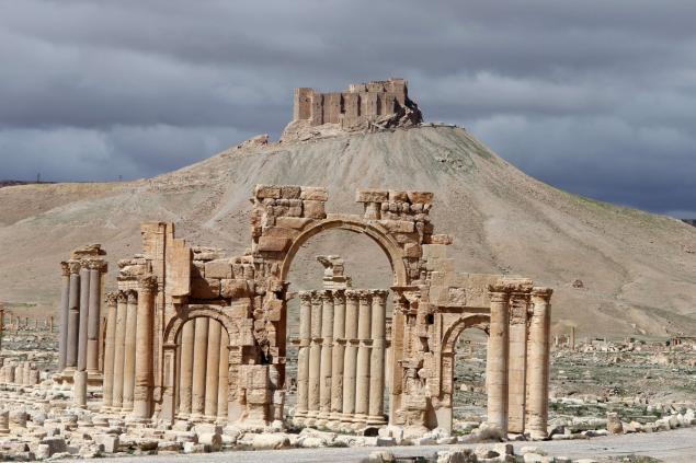 The famous Arch of Triumph and a partial view of the ancient oasis city of Palmyra before Islamic State extremists blew up the iconic piece of history