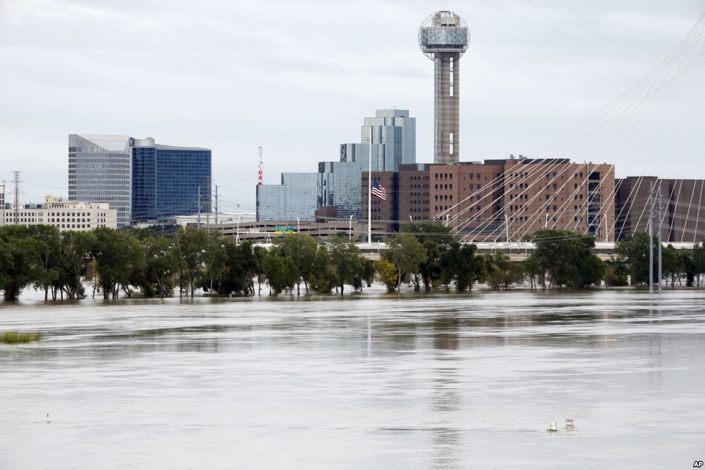 The rain-swollen Trinity River is seen with the city skyline in the background in Dallas Texas Oct. 24 2015. Southeast Texas was bracing for heavy rain late Saturday and into Sunday as the remnants of Hurricane Patricia combined with a powerful storm